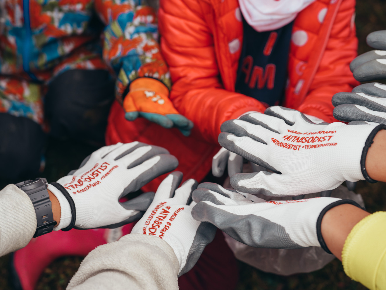 Hands of people joined together