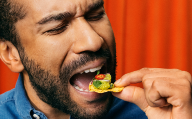 Man eating tortilla chips