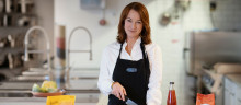 Paula Backman standing by the kitchen counter